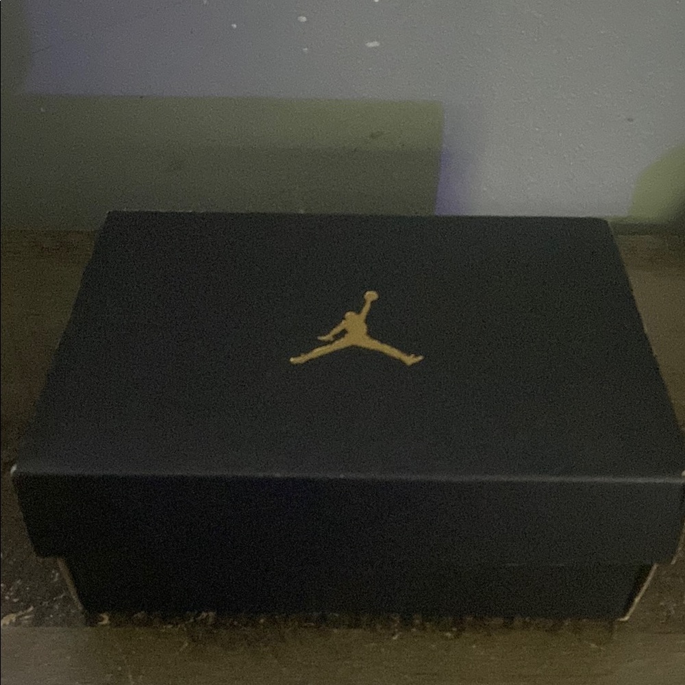 Jordan 12 black , red , white.